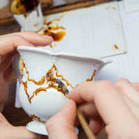 Dessertschale "B-Form Goldbronze", gestreute Blümchen
